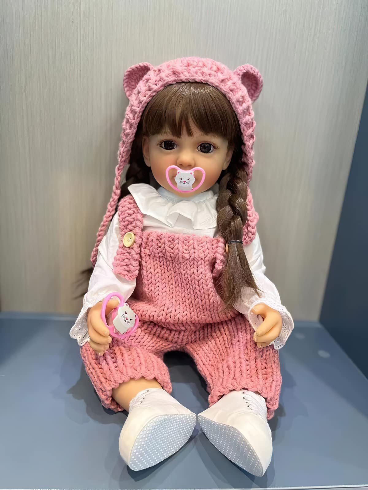 TERABITHIA 22 Inches Long Brown Hair Vinyl Full Body Anatomically Correct Lifelike Reborn Baby Doll Realistic Newborn Toddler Girl Dolls in Pink Woolen Set