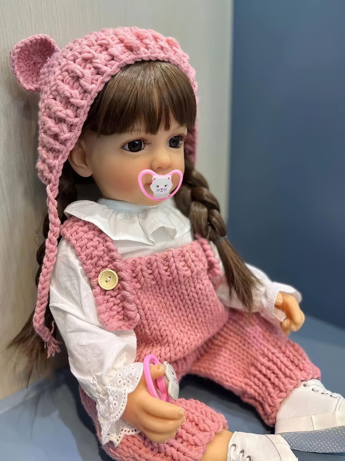 TERABITHIA 22 Inches Long Brown Hair Vinyl Full Body Anatomically Correct Lifelike Reborn Baby Doll Realistic Newborn Toddler Girl Dolls in Pink Woolen Set